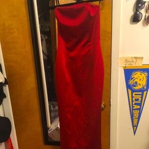 red evening gown with trail by Allen Schwartz
